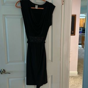 Lovely black dress for a semi formal event. Size large by studio.
